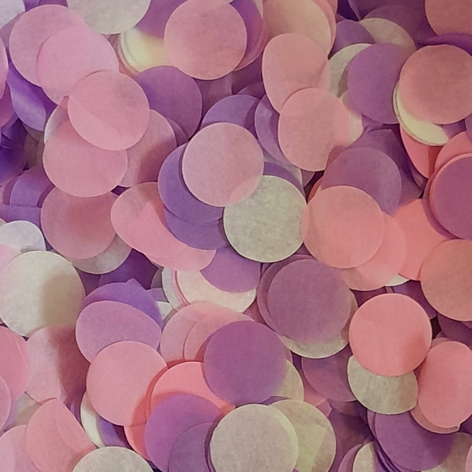 Pink, Purple and white tissue paper wedding confetti circles.