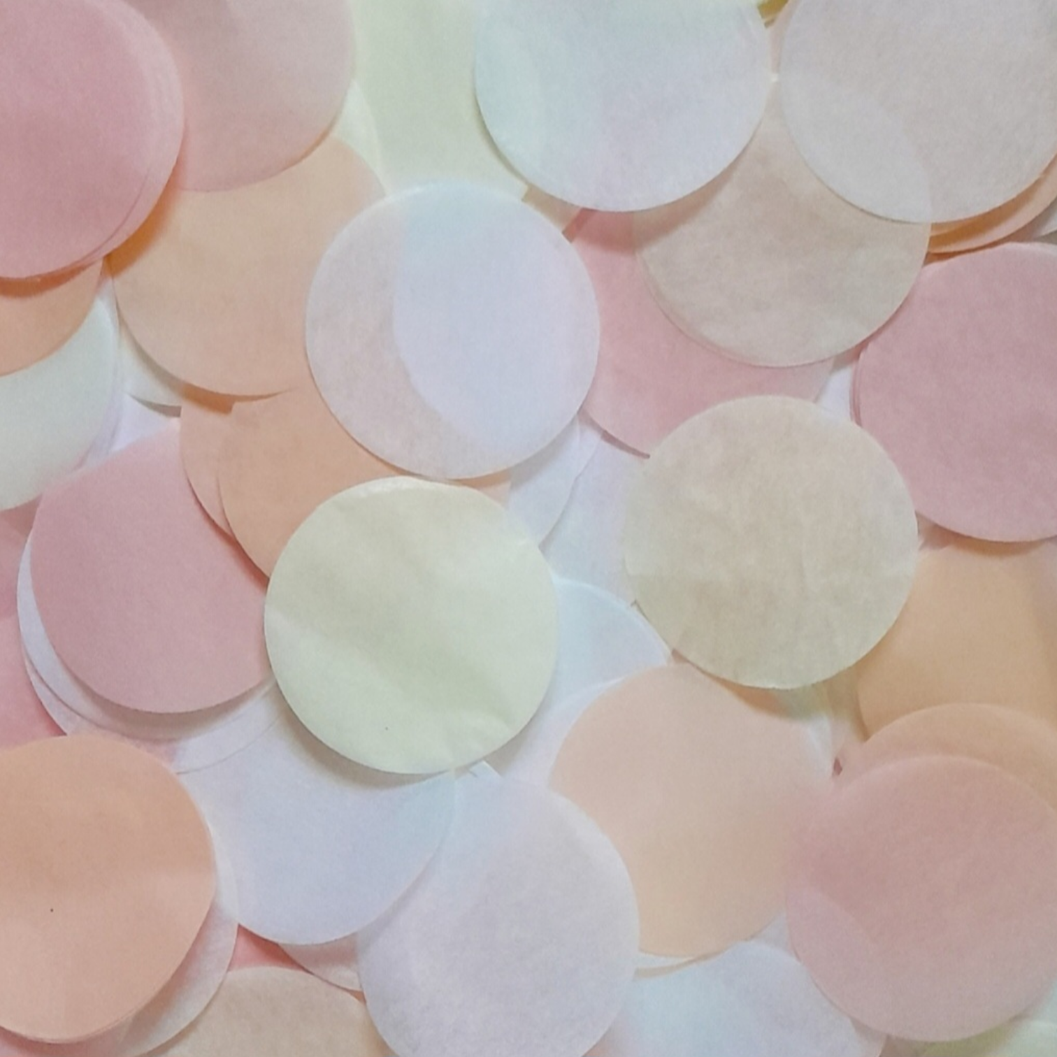 A mix of Pink, Peach Pastel Yellow & White Coloured Large Tissue Paper Confetti Circles.