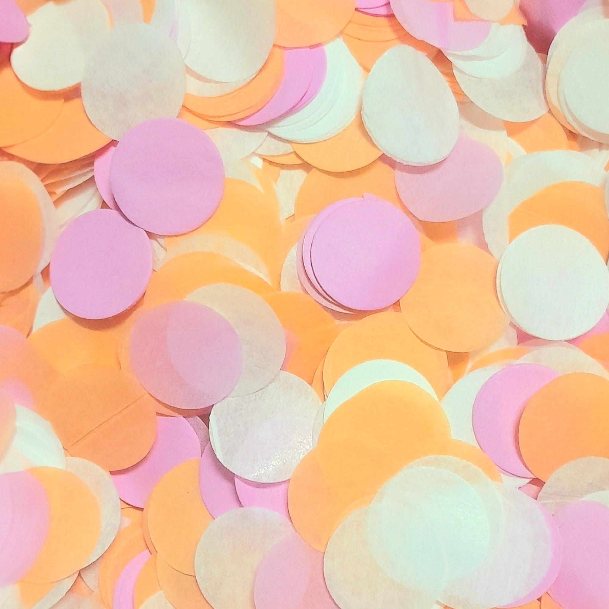 A mix of Pink, Orange and White Coloured Tissue Paper Confetti Circles.